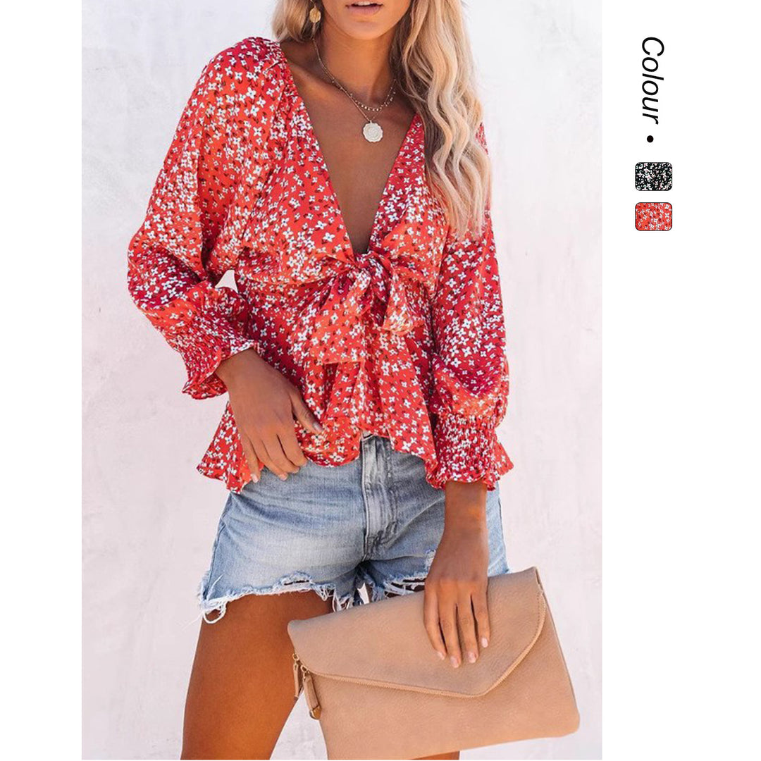 Damer bluse topp med leken blomsterdesign og elegant knute detaljer Skjora