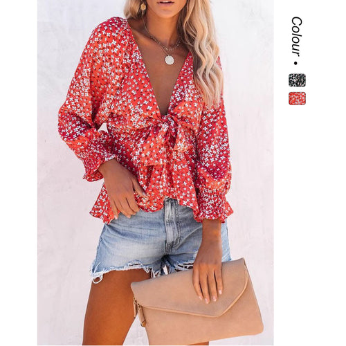 Damer bluse topp med leken blomsterdesign og elegant knute detaljer Skjora