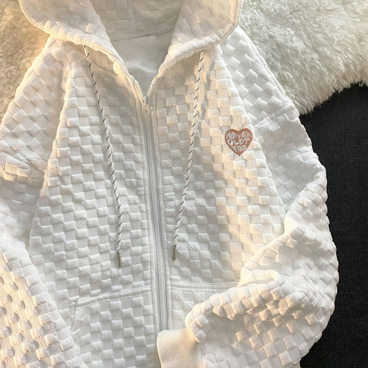 Dame hoodie-jakke laget av strukturelt materiale med praktiske lommer og fashionable design
