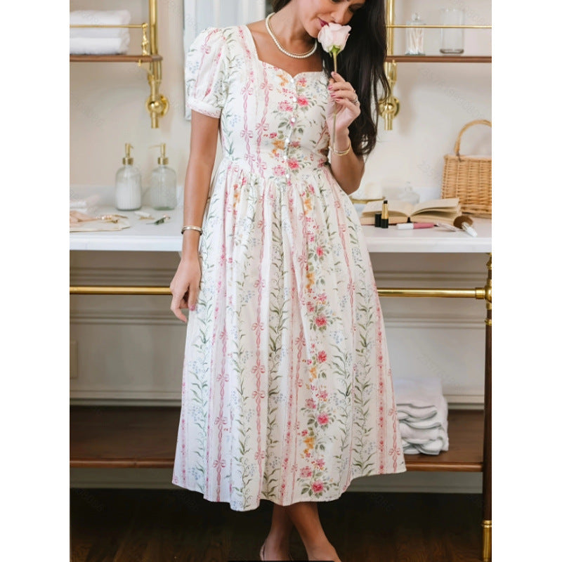Dame Maxikjole med blomsterdesign og lange puffermar