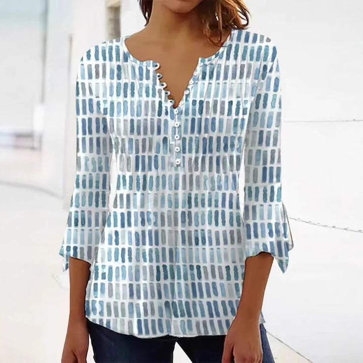 Damebluse i moderne grafisk design med knappe detaljer Skjora