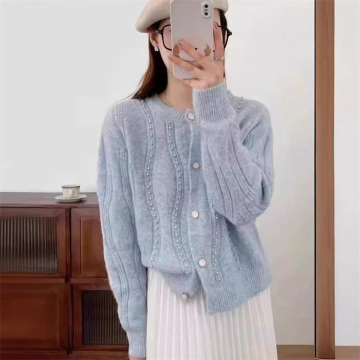 Dame cardigan med elegante perledetaljer og klassisk snitt Skjora