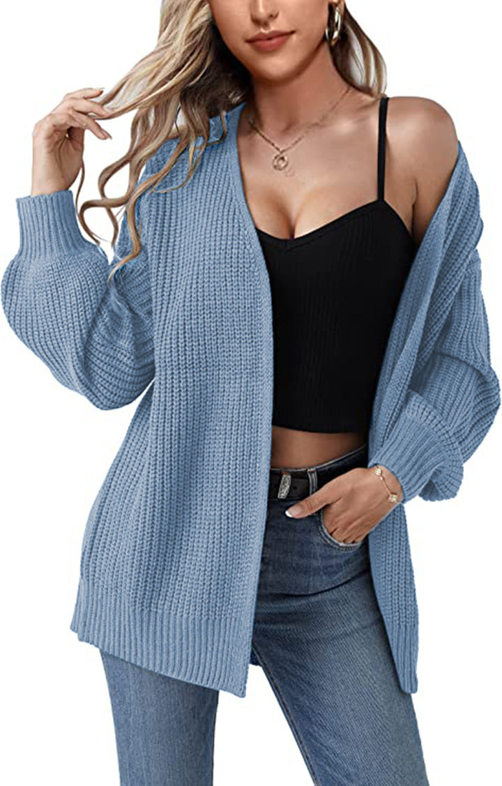 Kvinnens chunky strikket cardigan med en avslappet fasong og åpne masker Skjora