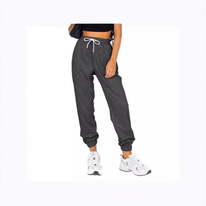Kvinne sporty joggebukser med praktisk snor og elastisk liv.