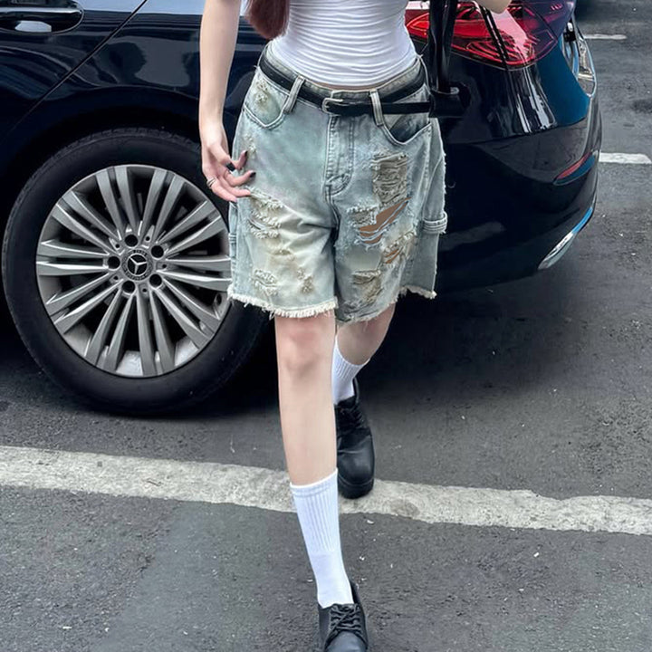 Dame Z ødelagte denimshorts med høy midje og flikete kanter Skjora