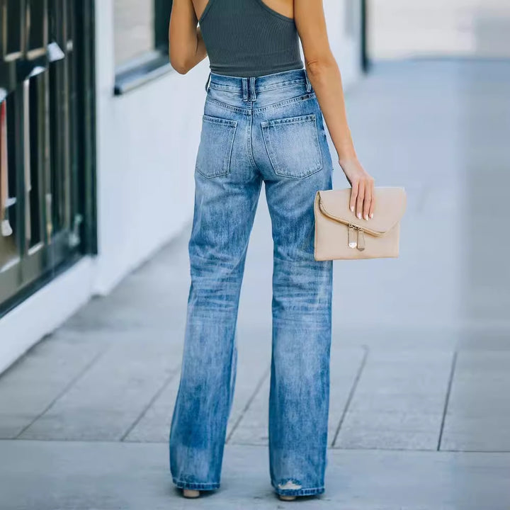 Kvinnelige vidde jeans med slitte effekter og høy liv