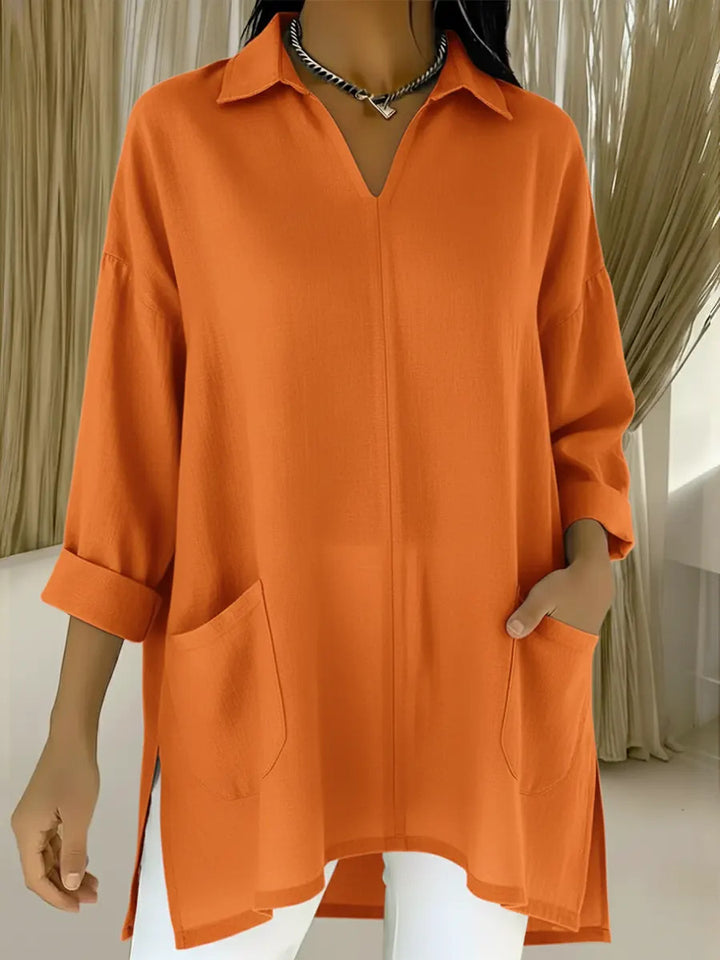 Dame langermet bluse med elegant V-hals og praktiske lommer Skjora