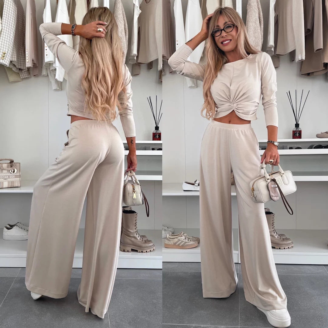 Kvinnes elegant fritidssett med crop top og vide bukser