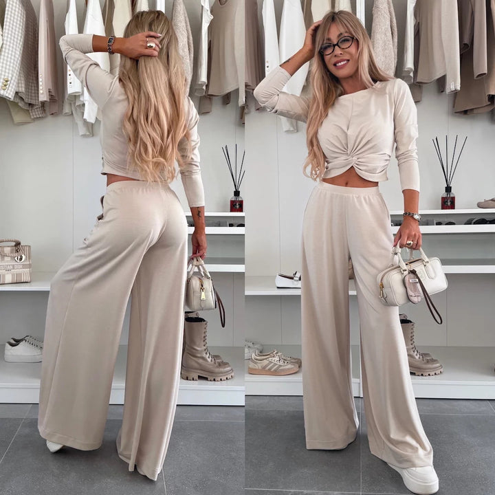 Kvinnes elegant fritidssett med crop top og vide bukser
