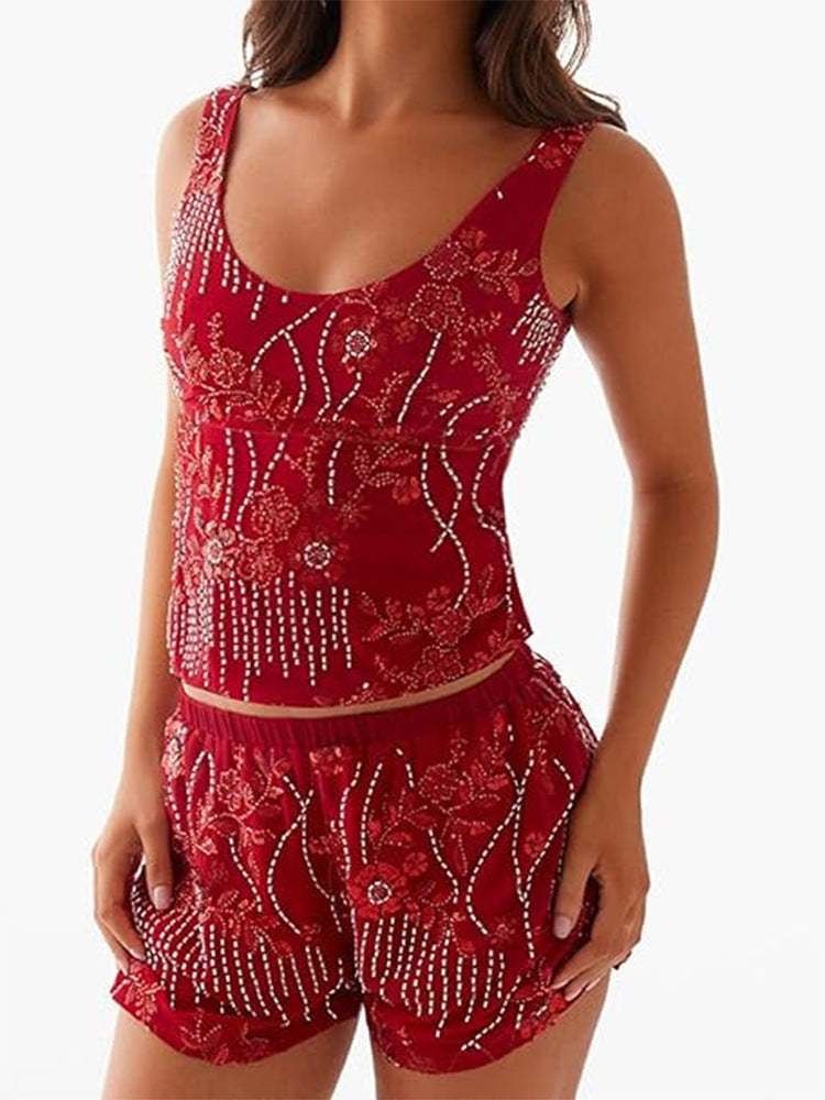 Damescouture topp med blomstret rhinestonesdesign og tettsittende snitt