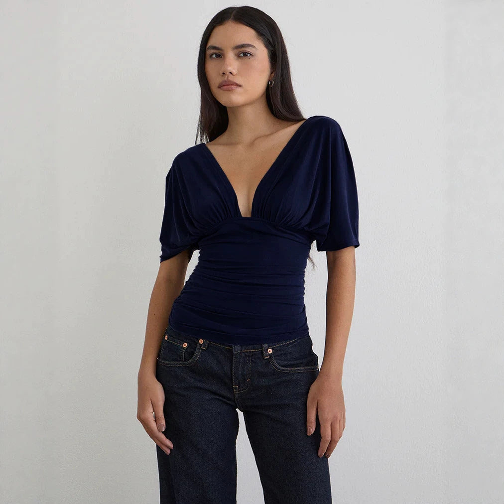 Dame Elegant topp med dyp V-hals og avslappet draperingsdesign Skjora