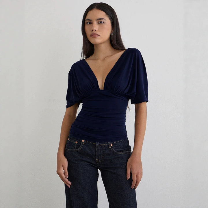Dame Elegant topp med dyp V-hals og avslappet draperingsdesign Skjora