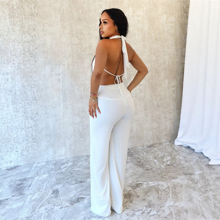 Dame jumpsuit med elegant innpakningsdetalj og vide benpartier Skjora