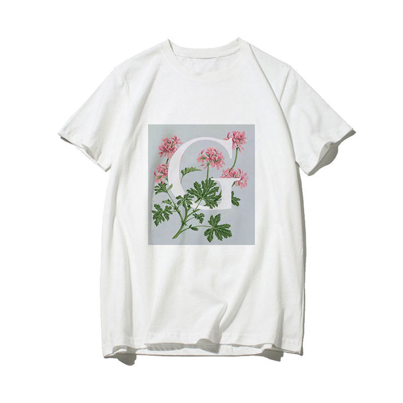 Dame T-skjorte med blomsterdesign og kreativt trykk Skjora
