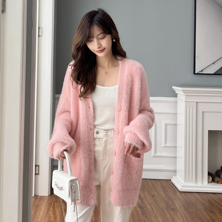 Dames fluffy cardigan med lommer og brede klaffer Skjora