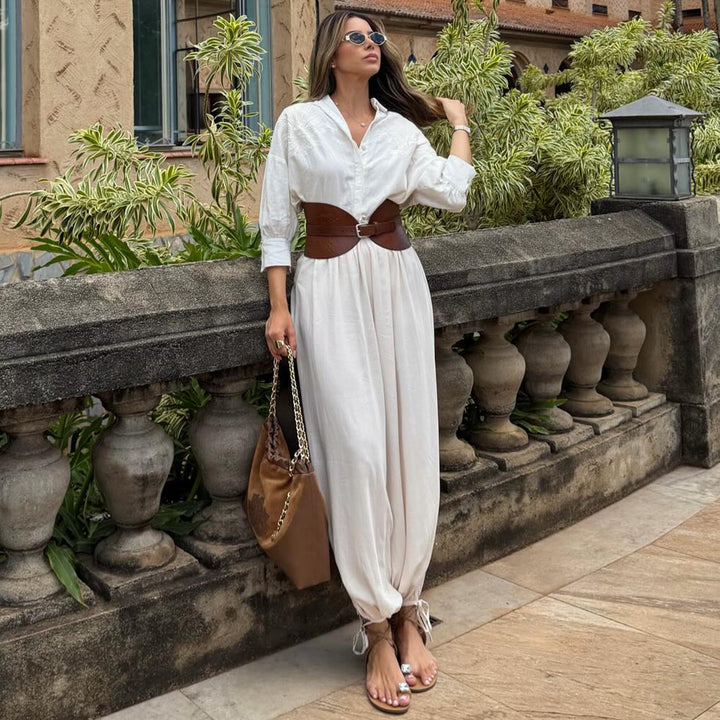 Kvinnens voluminøse jumpsuit med elegant knapp-bluse og Livbelte Skjora