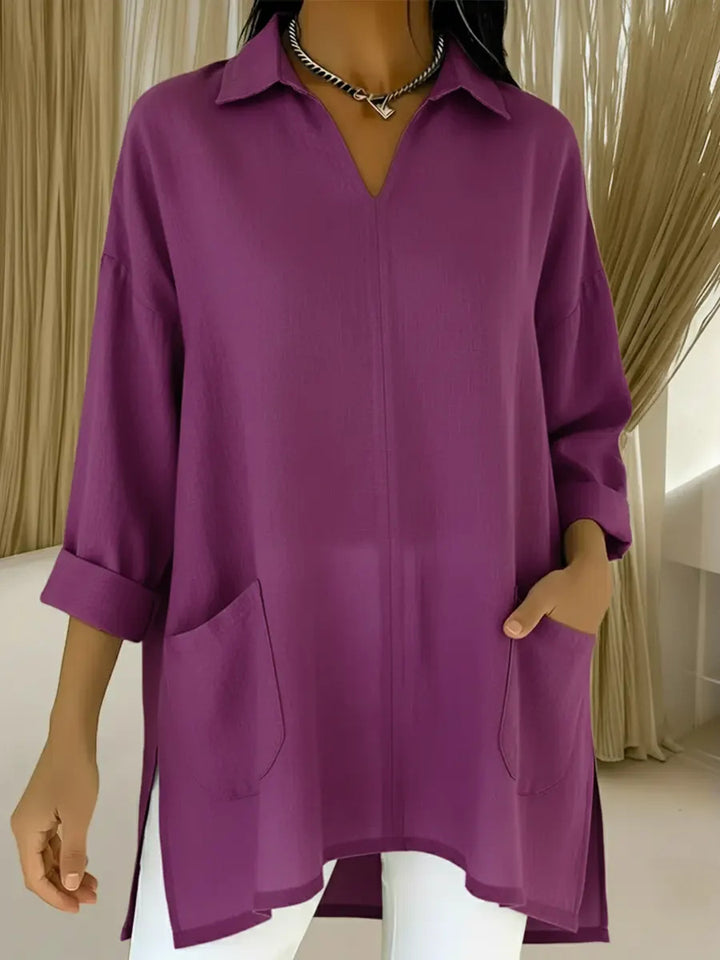 Dame langermet bluse med elegant V-hals og praktiske lommer Skjora