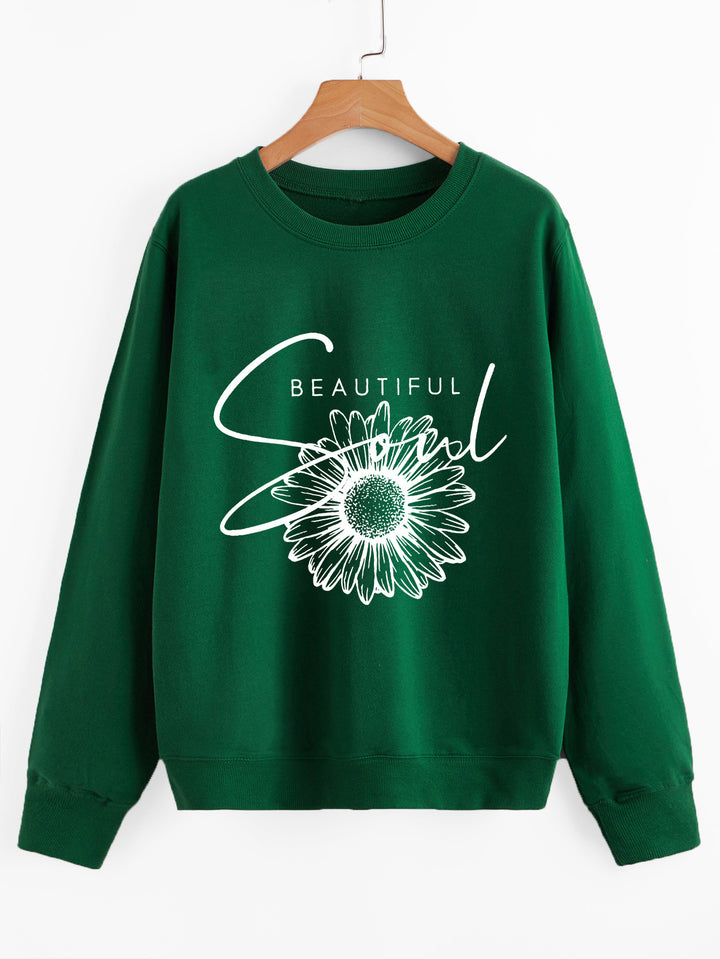 Dame genser med blomstermotiv og inspirerende tekst Skjora