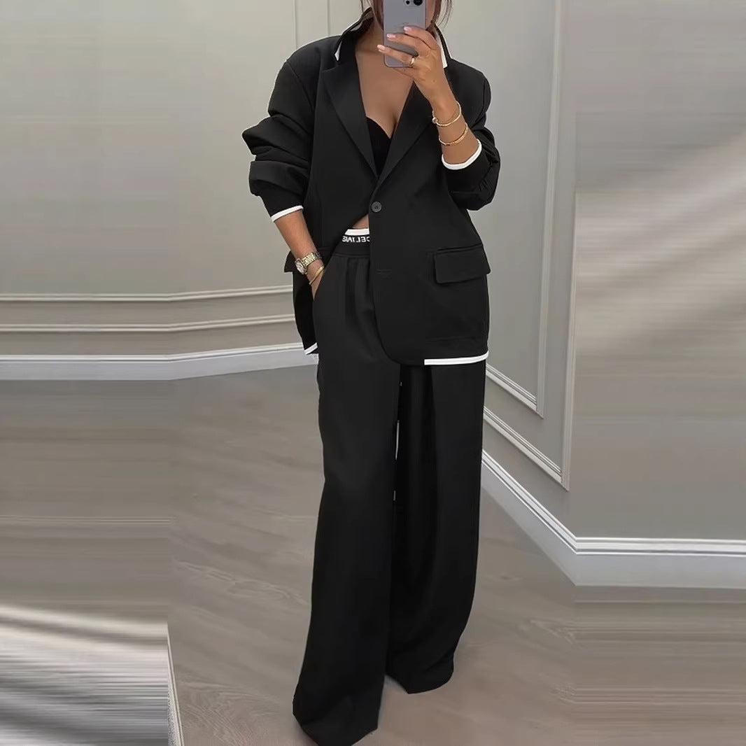 Kvinnes moderne oversized blazer sett med elegante dressbukser Skjora
