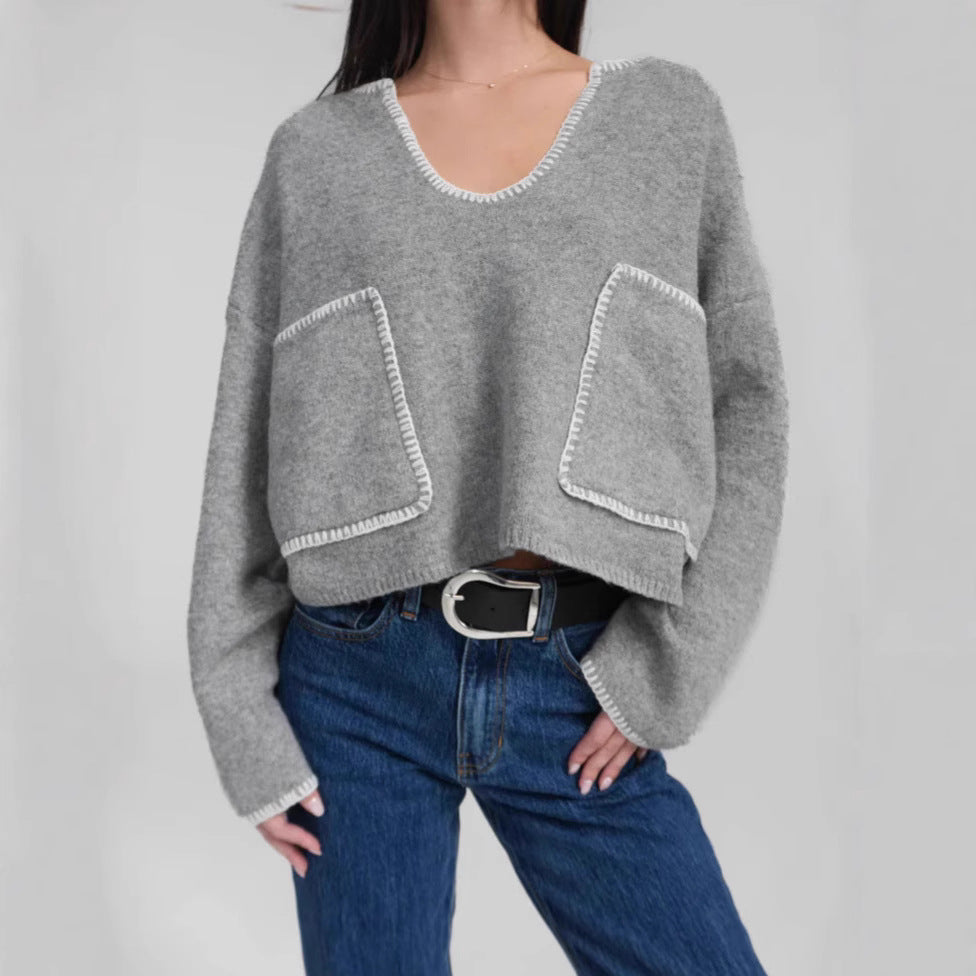 Kvinnenes koselige korte genser med asymmetrisk design og praktiske lommer Skjora