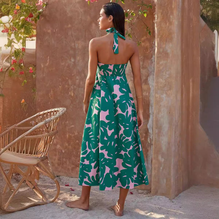 Kvinne maxi kjole med blomster bandeau design og elegant utsvingt skjørt