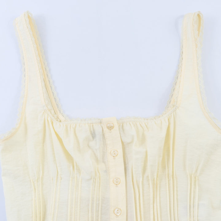 Dame-Crop-Top med fine folder og pynteknapper Skjora