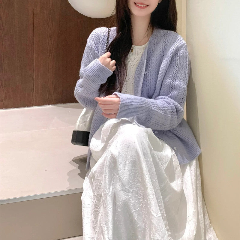 Dame cardigan med delikat mønster og knappdetaljer Skjora