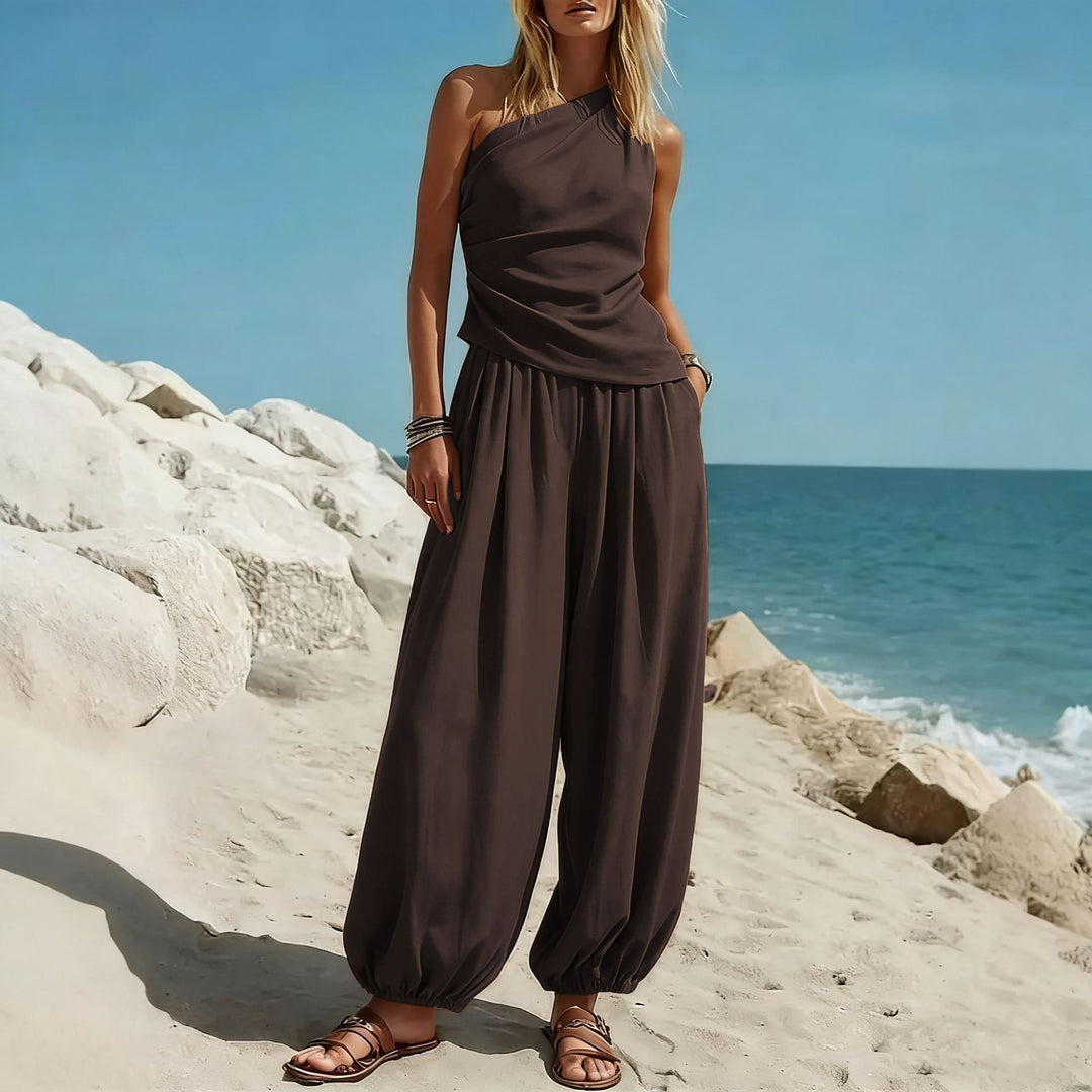 Damer Elegant Einteiler-Outfit med Flytende Snitt og One-Shoulder-Design Skjora