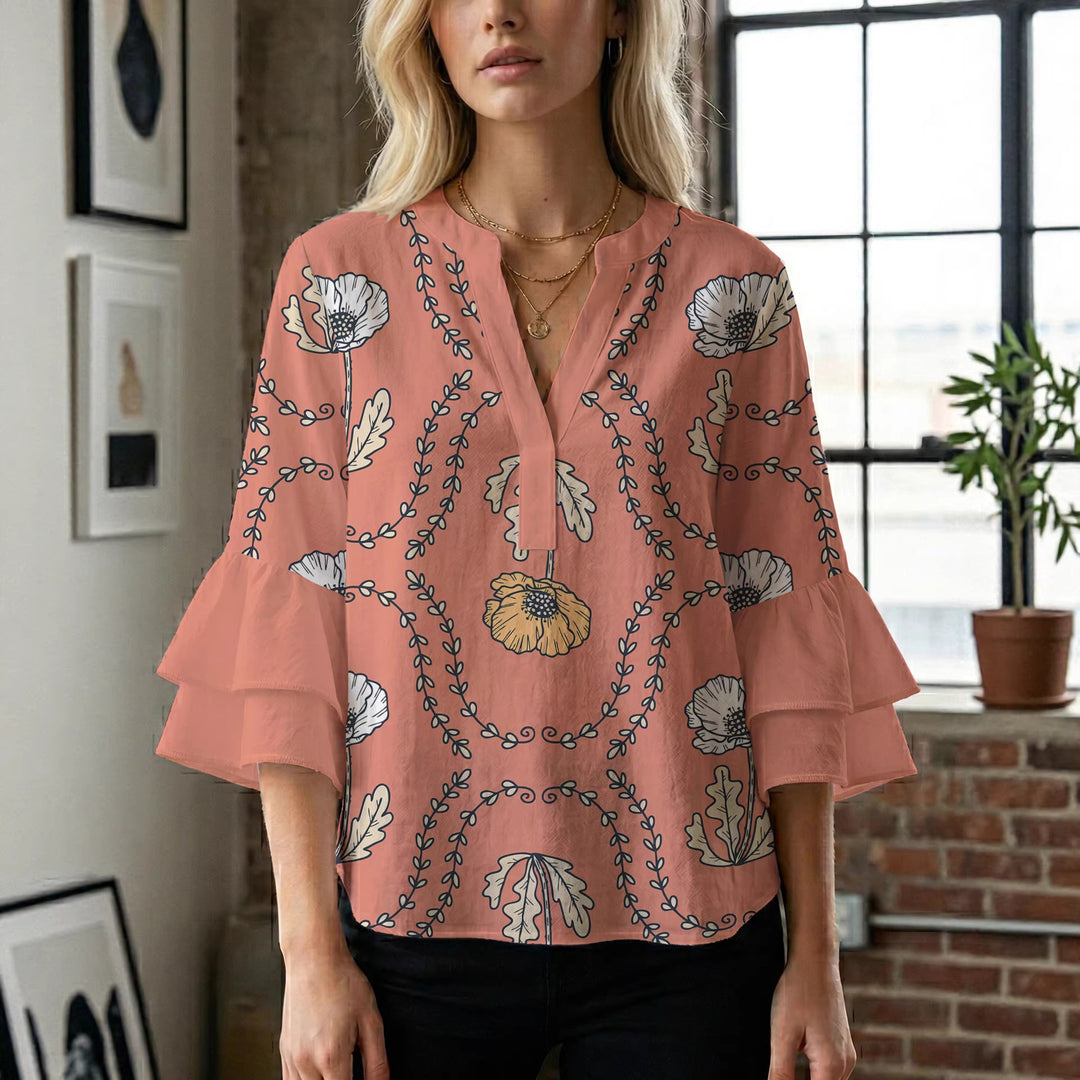 Damebluse med voluminøse puffermer og kreativt blomstermønster Skjora