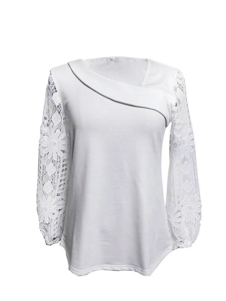 Dame designerbluse med blonder og elegant snitt Skjora