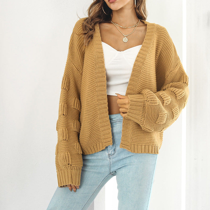 Kvinne chunky strikket cardigan med voluminøse ermer og åpen front Skjora