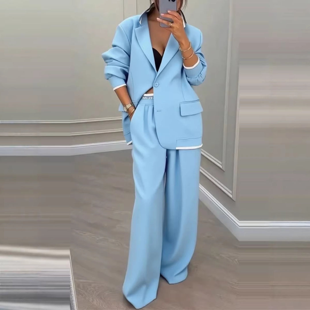 Kvinnes moderne oversized blazer sett med elegante dressbukser Skjora