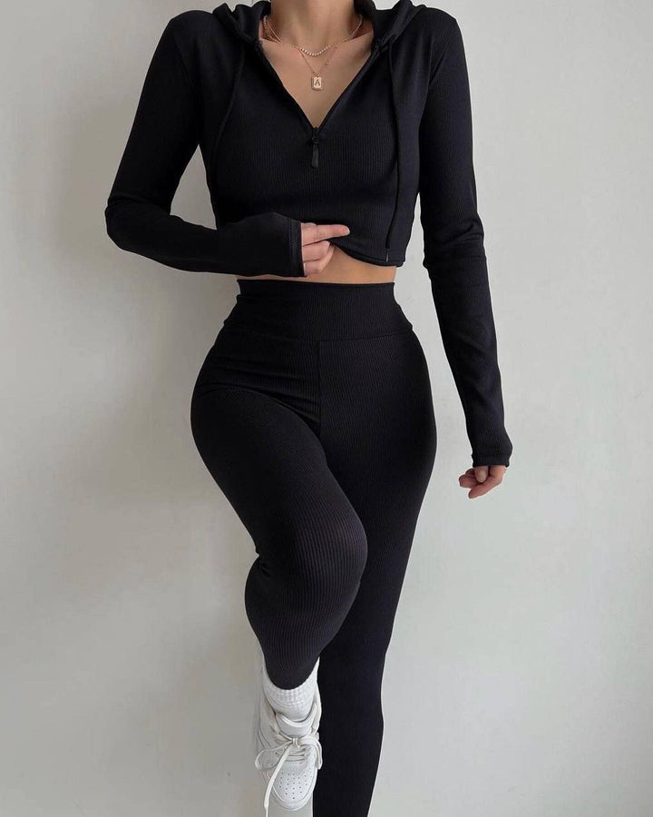 Kvinnenes sporty langermet jumpsuit med glidelås og figurnær passform Skjora
