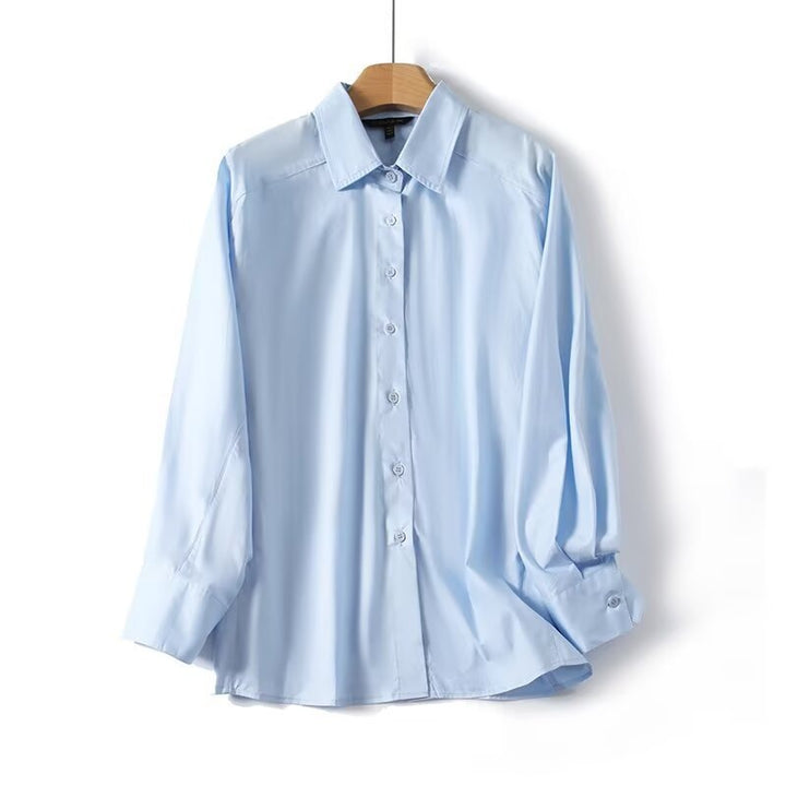 Dame elegant langermet bluse med moderne detaljer og strukturert stoff Skjora