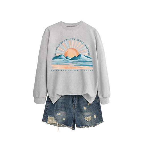 Kvinne sweatshirt med inspirerende soloppgang design og avslappet passform Skjora