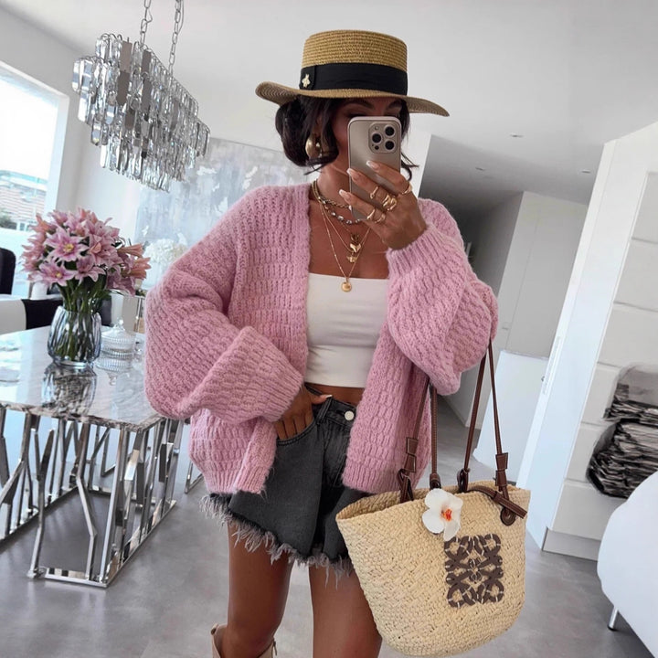 Kvinnes chunky strikk cardigan med voluminøse ermer og åpen front Skjora