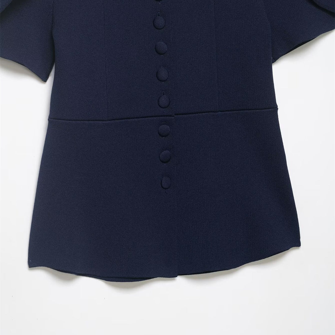 Damebluse med strukturerte puffarmer og knappedetalj Skjora