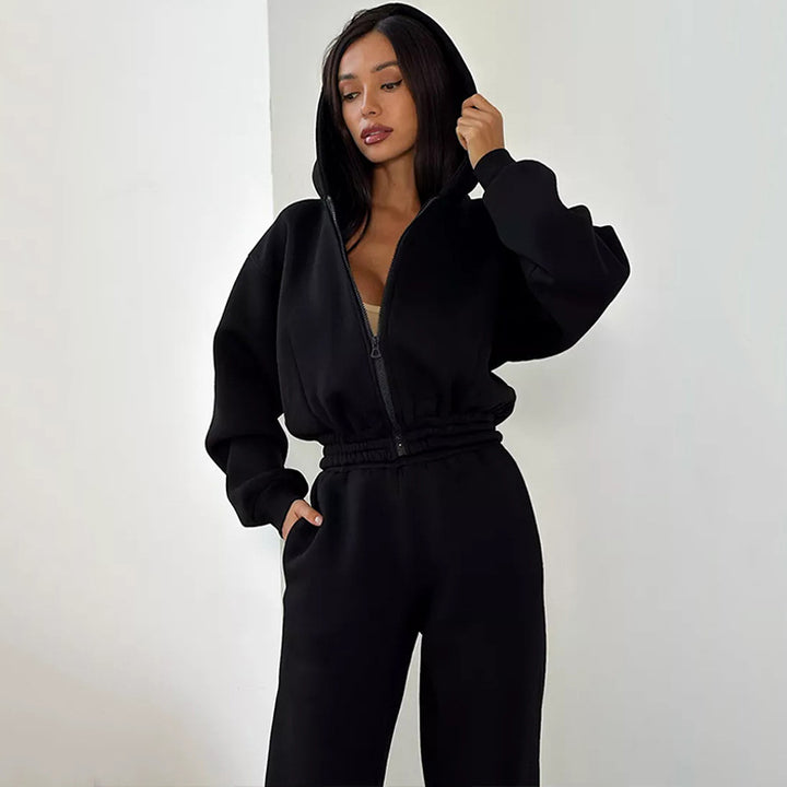 Kvinners sporty fleece jumpsuit med hette og løs passform Skjora