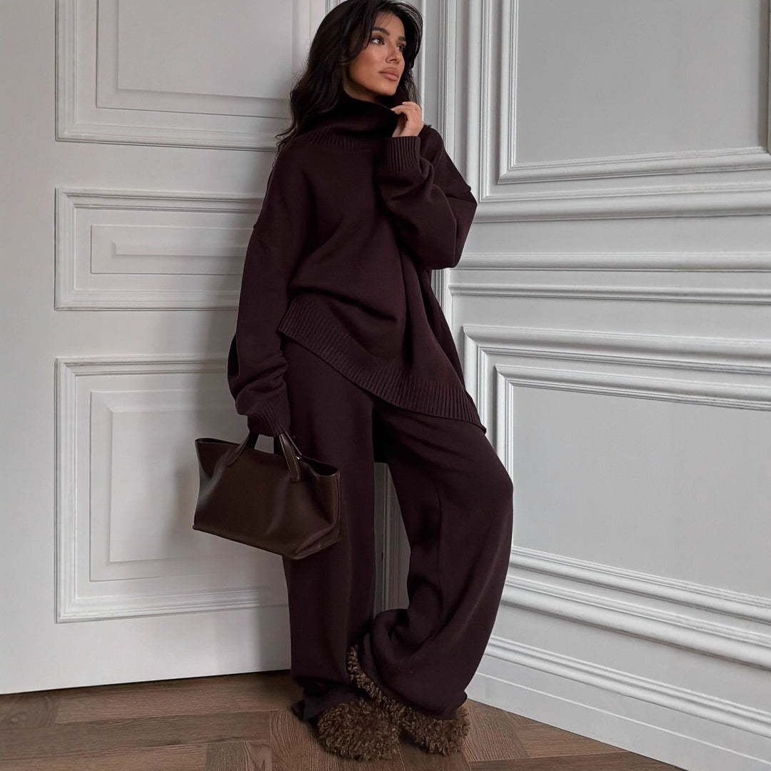 Kvinnelig oversized strikkegenser med høy krage og loose cut bukser Skjora