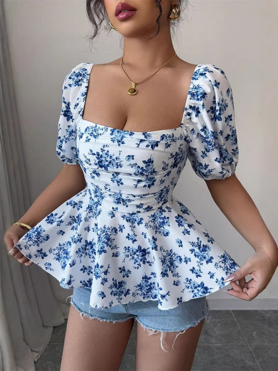 Dame Peplum-bluse med pufferm og blomstermønster Skjora