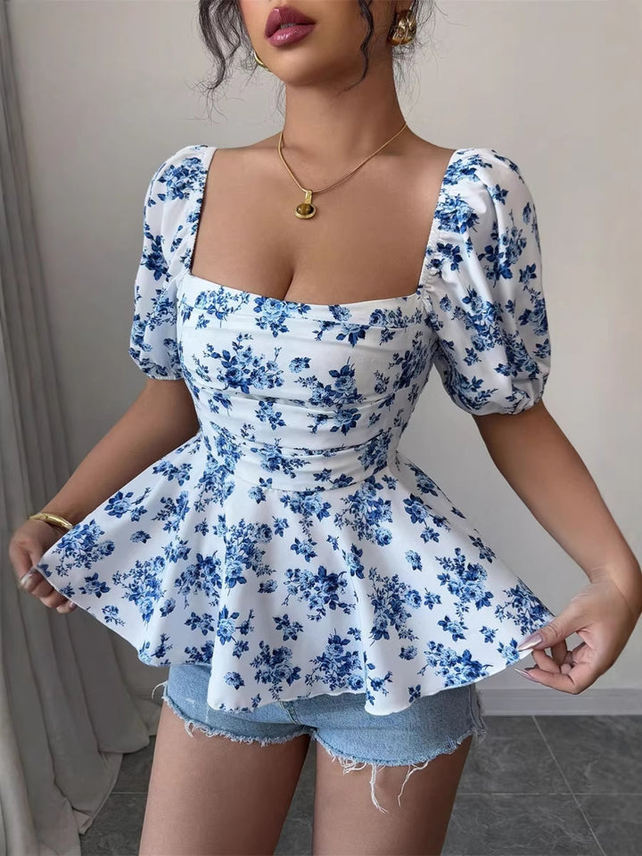 Dame Peplum-bluse med pufferm og blomstermønster Skjora