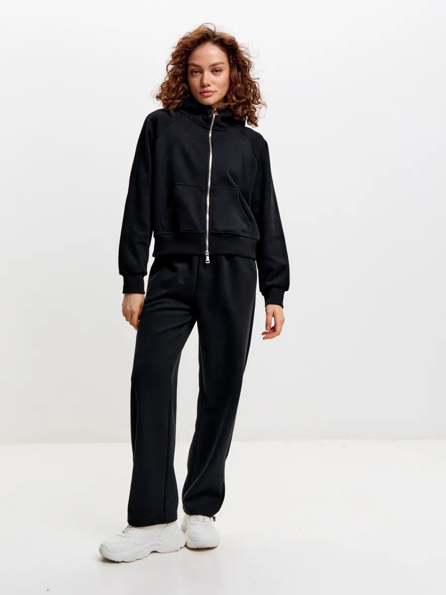 Kvinnelig sporty fleece treningsdrakt med kontinuerlig glidelås og praktiske lommer Skjora