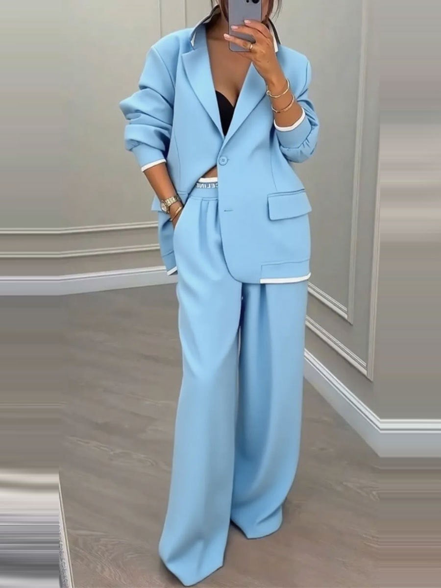 Kvinnes moderne oversized blazer sett med elegante dressbukser Skjora