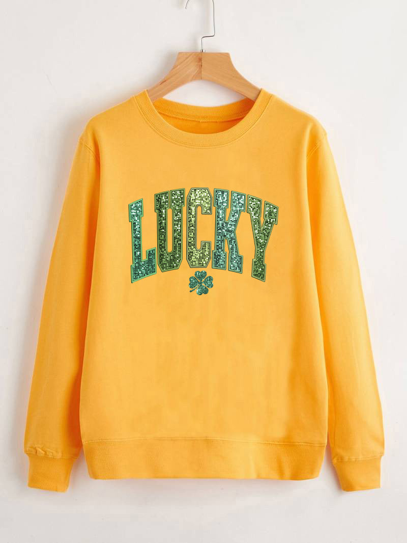 Dame uformell sweatshirt med glitrende skrift og firkløvermotiv Skjora