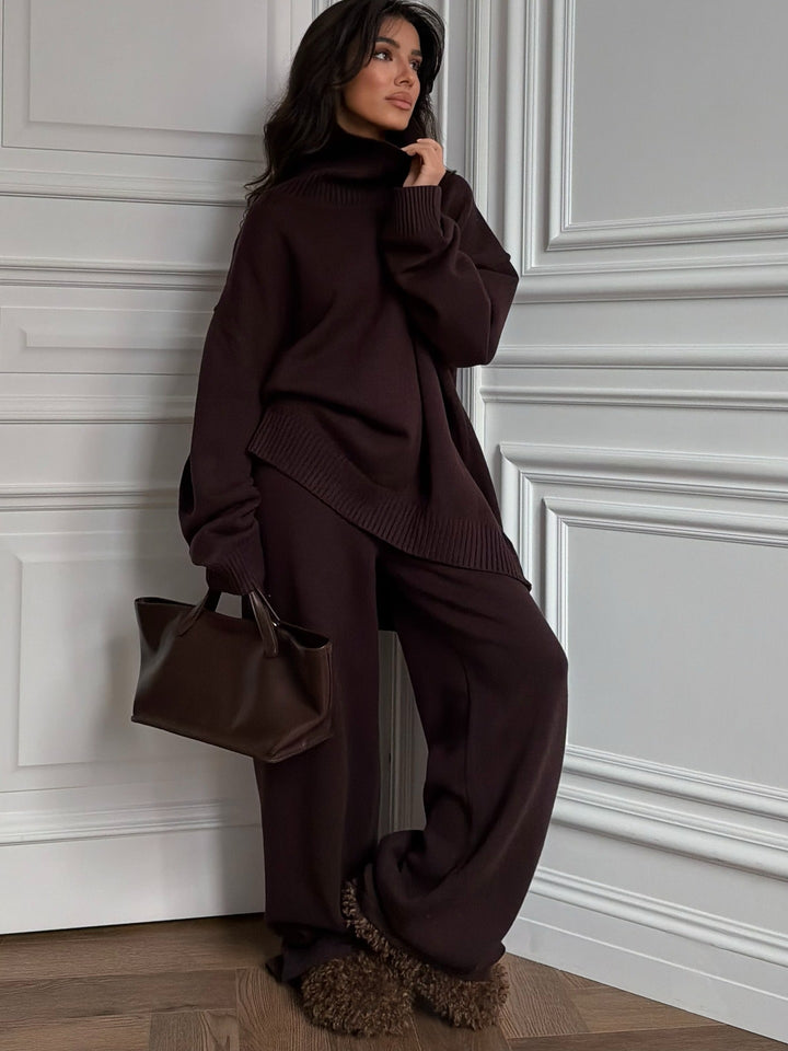 Kvinnelig oversized strikkegenser med høy krage og loose cut bukser Skjora