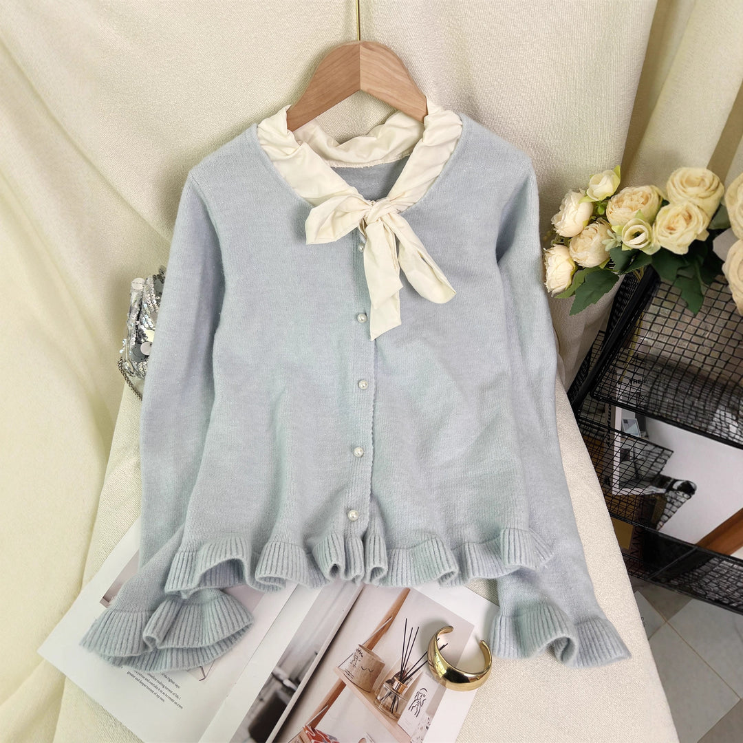 Kvinnes elegant cardigan med volanger og sløyfekrage Skjora