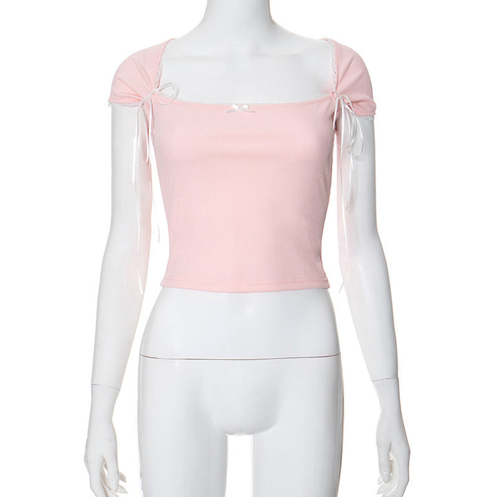 Dame Crop-top med justerbare spaghetti-stropper og elegante knute-detaljer Skjora