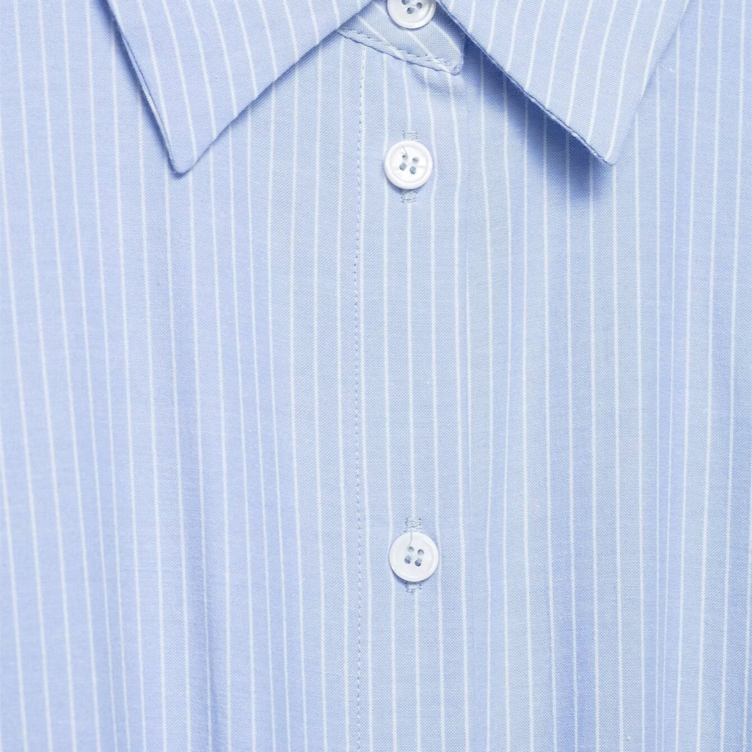 Damebluse med asymmetrisk knute og raffinert drapering Skjora