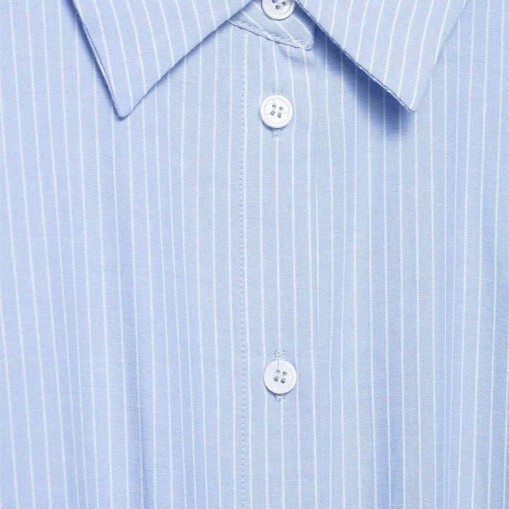 Damebluse med asymmetrisk knute og raffinert drapering Skjora