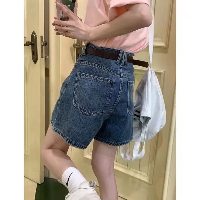 Kvinne denim shorts med høye lommer og løs passform